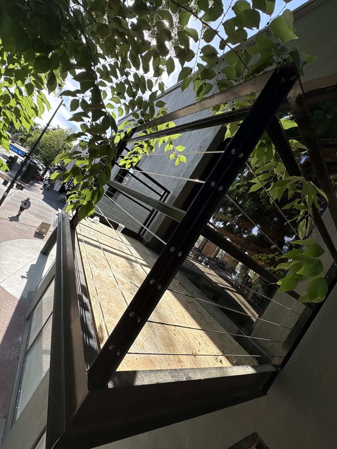 Stainless cable guardrail infill installed outdoors, 2 of 2